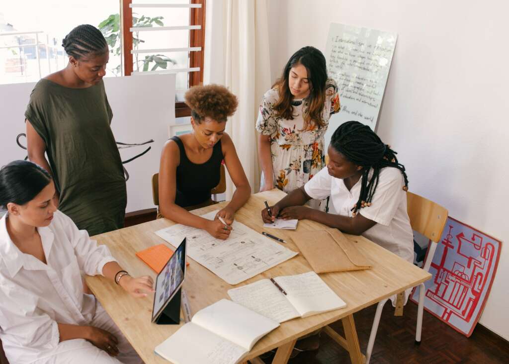 employee meeting deciding on corporate swag provider