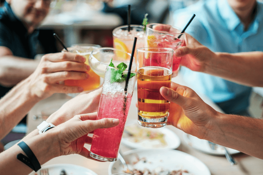 Group of people share a cheer to celebrate.