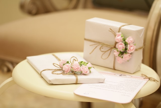 Two presents on a table with a letter