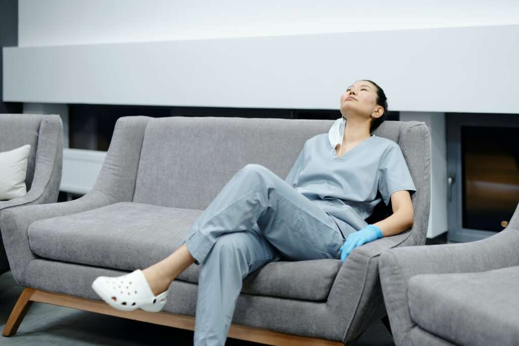 nurse that is resting on a couch