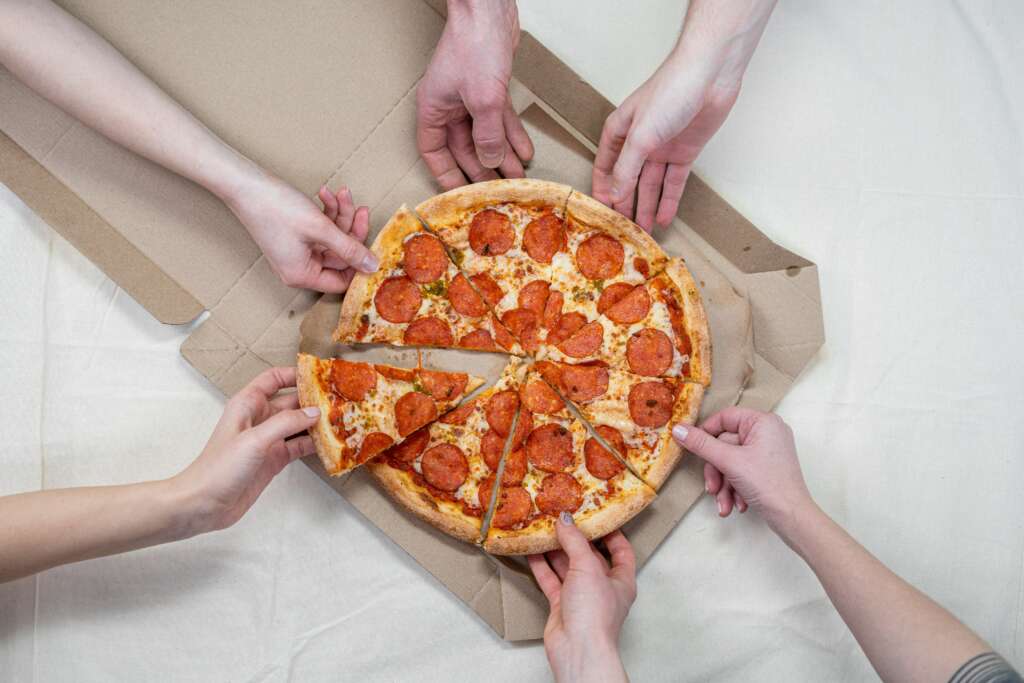 A pizza party is a Fun Office Activity Idea if everyone is in-person.