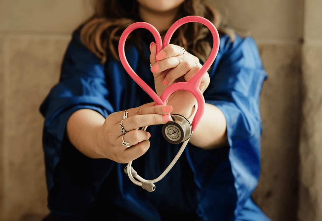 nurse makes heart 