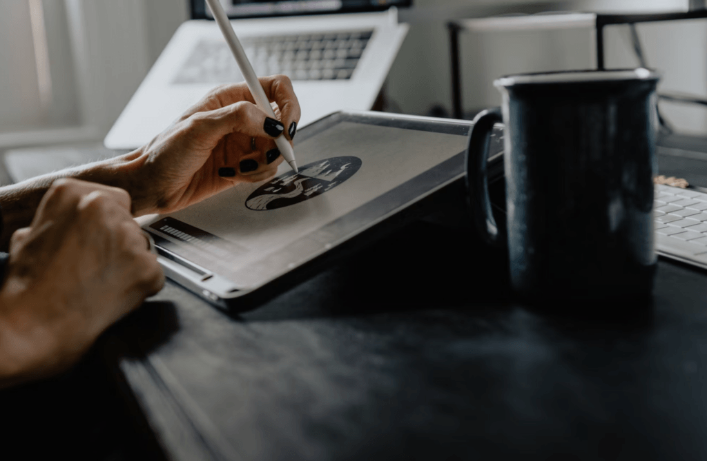 artist drawing on a tablet