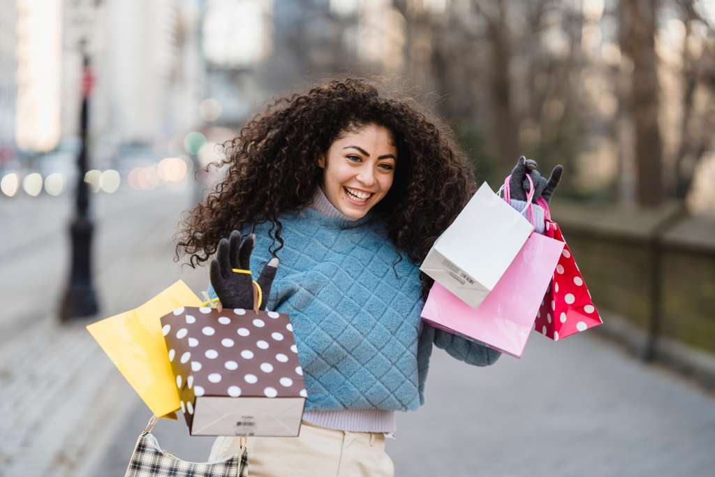 woman holding gift bags