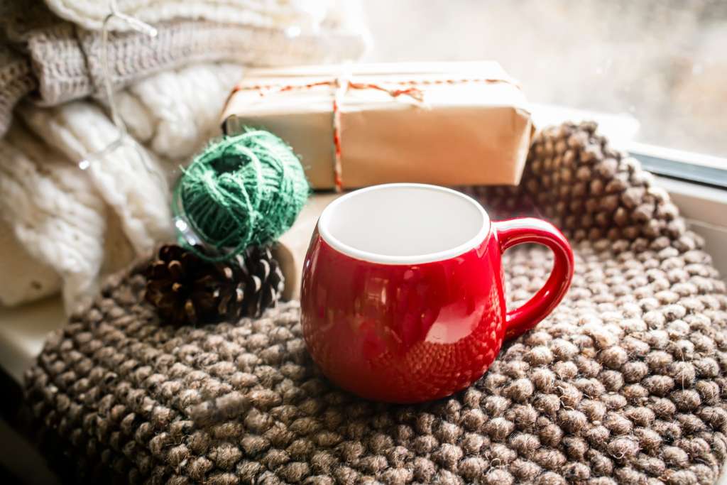 https://blogcdn.swagmagic.com/wp-content/uploads/2023/05/an-empty-red-christmas-cup-on-a-cozy-blanket-1024x683.jpg