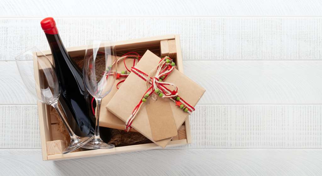 Box with red wine and gifts