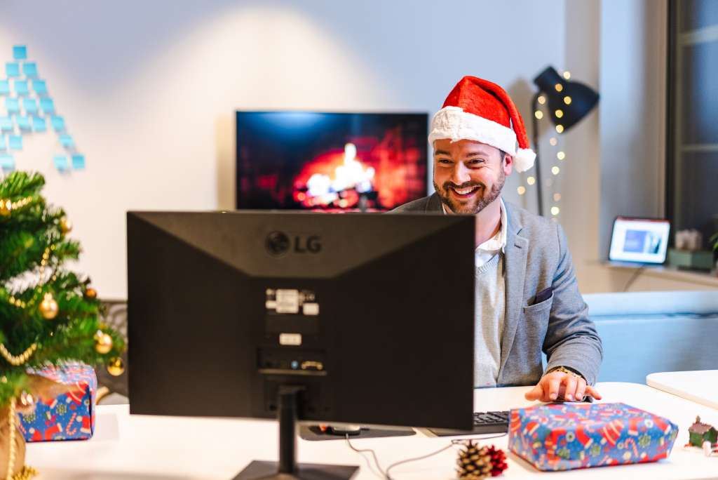 Employee with gifts around holiday season