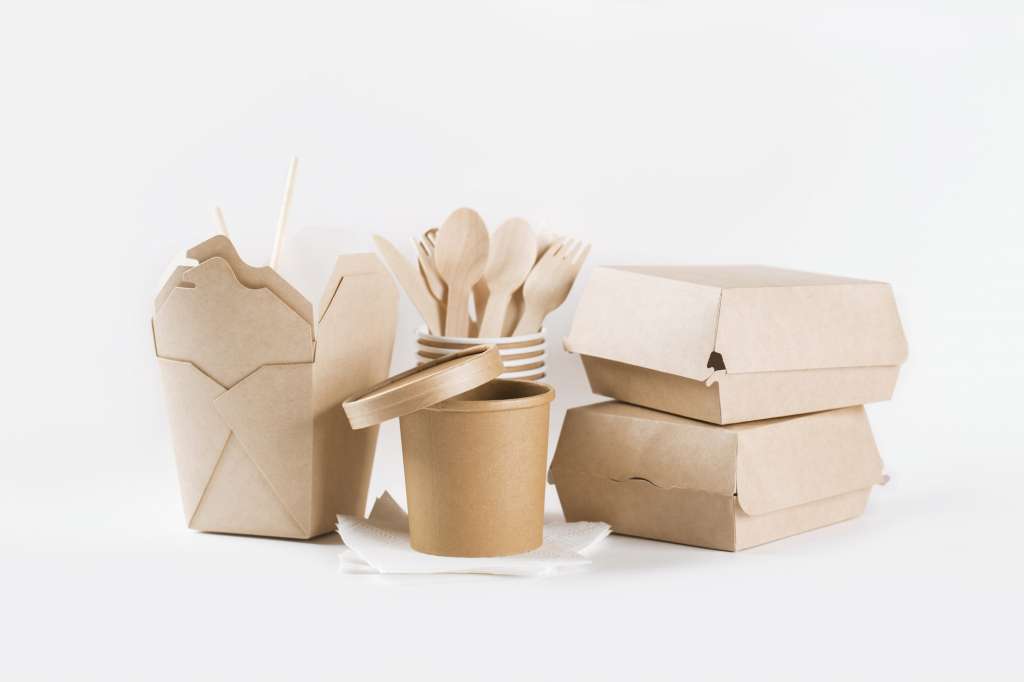 Eco craft paper tableware. Paper cups, dishes, fast food containers and wooden cutlery