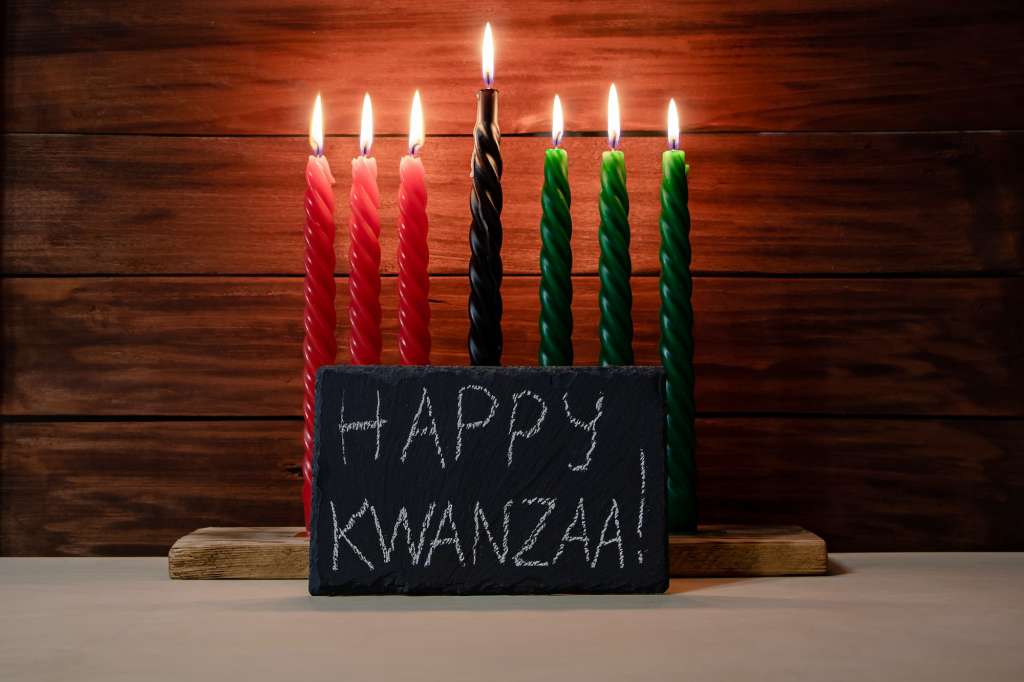 Happy Kwanzaa. African American holiday. Seven candles red, black and green