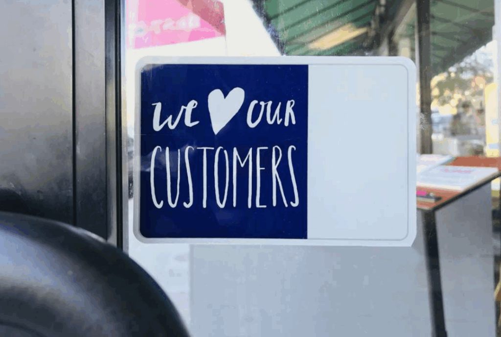 We love our customers sign on a door