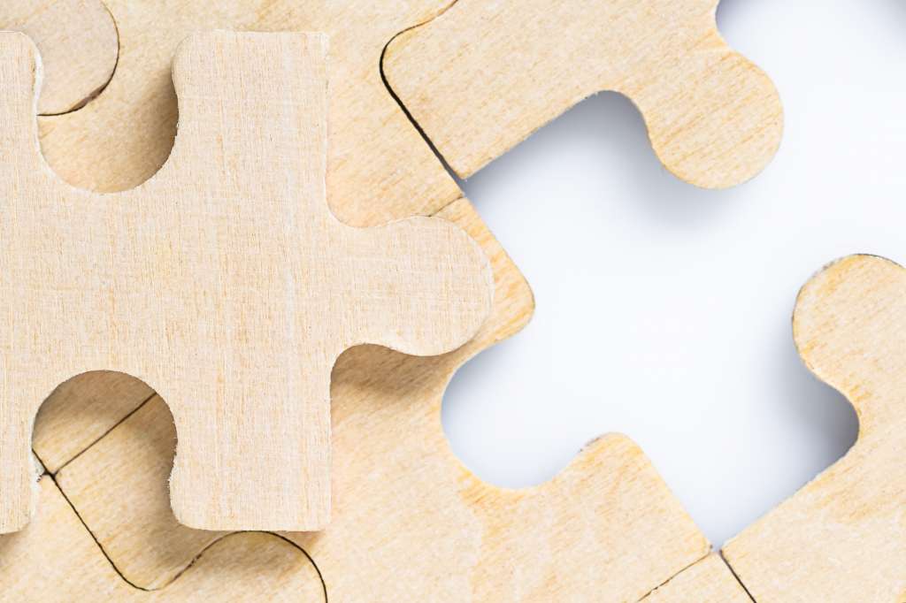 Missing jigsaw puzzle pieces on white_-11