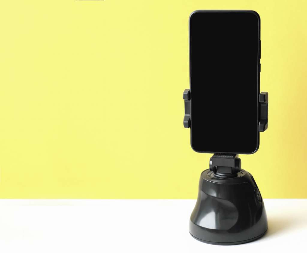 smartphone on a cell phone holder, mock up screen for your picture placement.