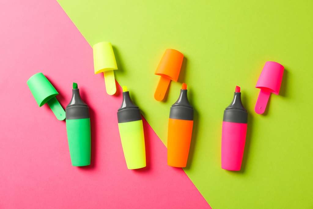 Open highlighters on two tone background, space for text