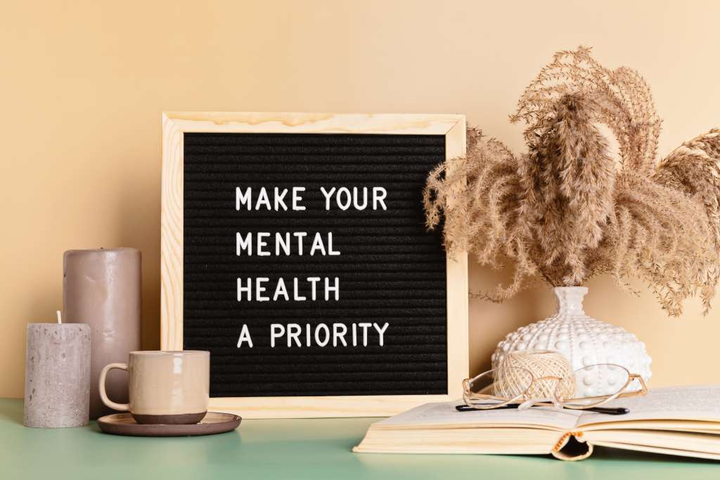 Make your mental health a priority motivational quote on the letter board
